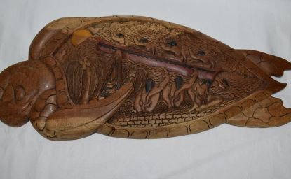 An image of traditional Palau wood carving telling the story of sea turtles